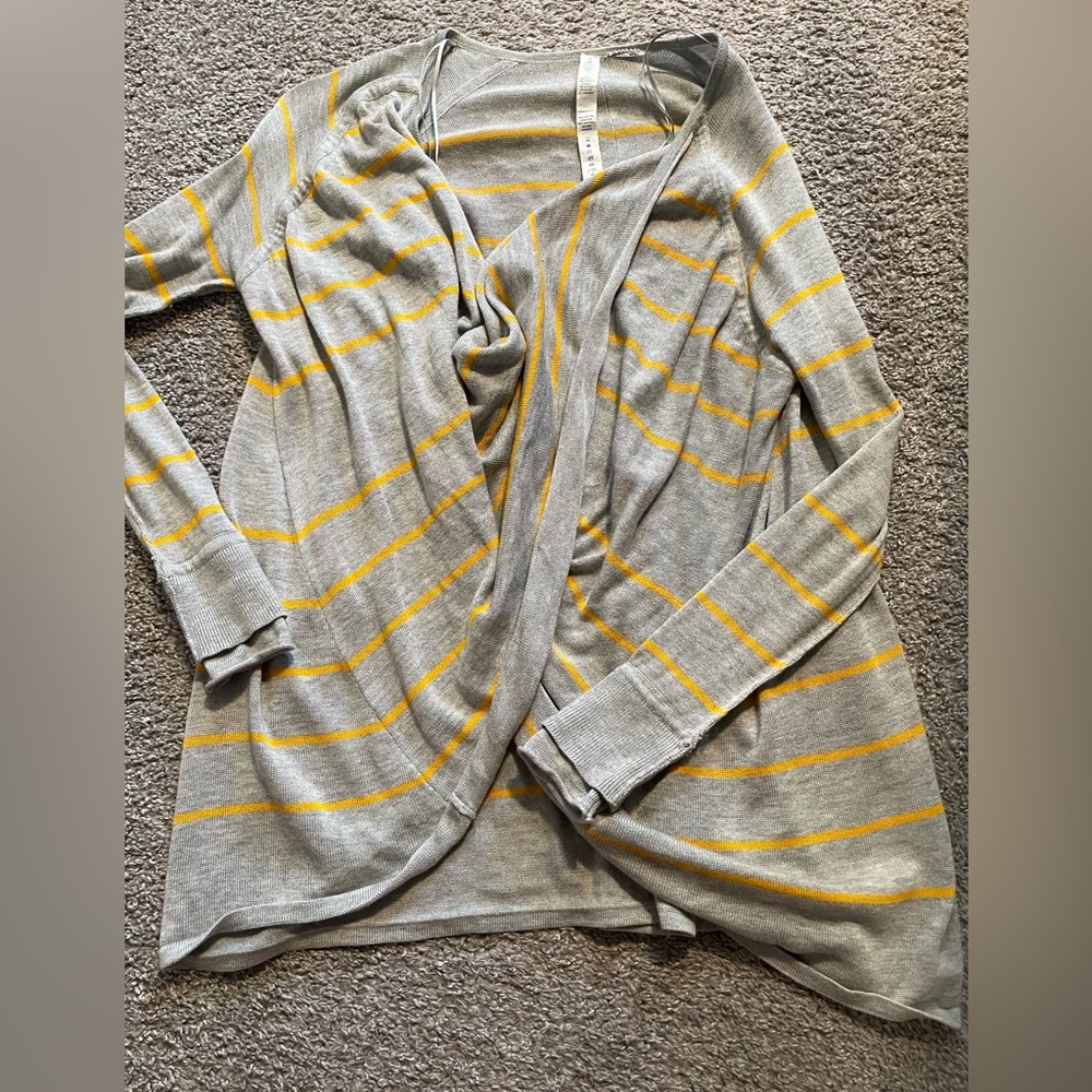 Lululemon size 4 gray and yellow striped sweater. Comes from a smoke free home